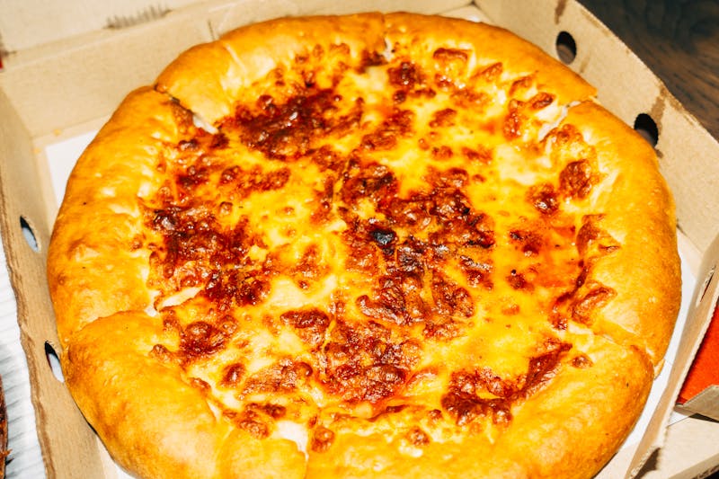 Four cheese pizza with gooey melted cheese blend