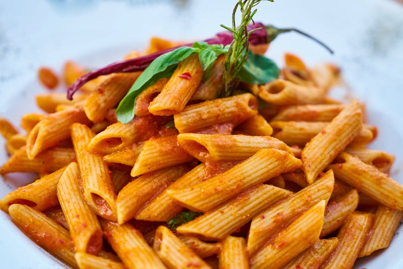 Spicy penne arrabbiata with chili and tomato sauce